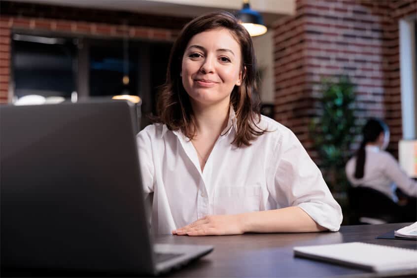 woman working on a laptop for seo optimization for small business